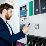 Man paying with phone at the gas station